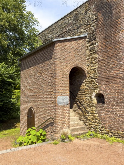Stenshofturm, so-called Romanesque house made of sandstone from the 12th century in a model garden in Grugapark, Essen, North Rhine-Westphalia, Germany