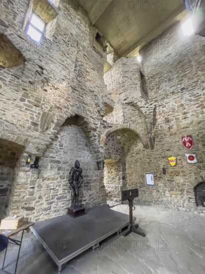 View of the interior of the restored historic castle tower of Altendorf Castle in the Burgaltendorf district, modern concrete ceiling above as weather protection and viewing platform, Essen, North Rhine-Westphalia, Germany