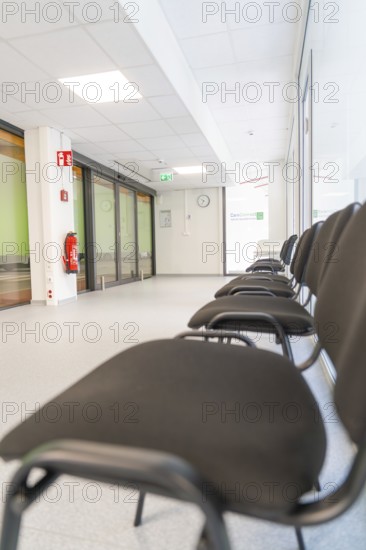 Bright hallway with minimalist chairs in the waiting area, Care Connect, vaccination kiosk for refugees, Calw, Germany