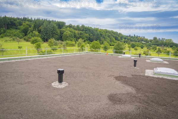 Green roof with several ventilation shafts and cloudy sky, roof greening, house construction, climate neutral