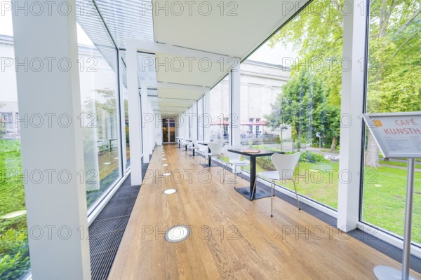 A modern café with glass walls and garden views, bright and open, Frieder Burda Museum, Baden Baden, Germany