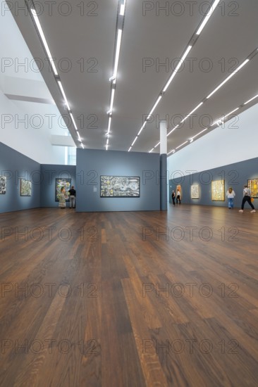 Large room with wooden floor and modern art on the walls under bright lighting, Frieder Burda Museum, Baden Baden, Germany