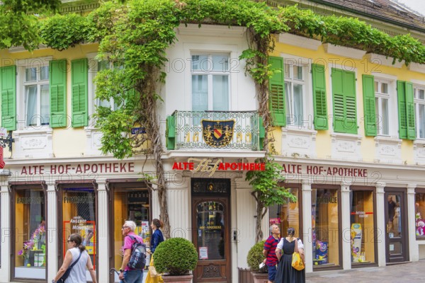 Historic pharmacy with greenery and a lively atmosphere, Baden Baden, Germany