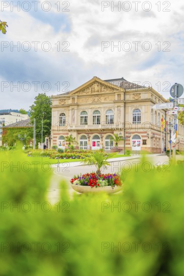 View of a historic building, surrounded by a beautiful garden and flowering plants, Baden Baden, Germany
