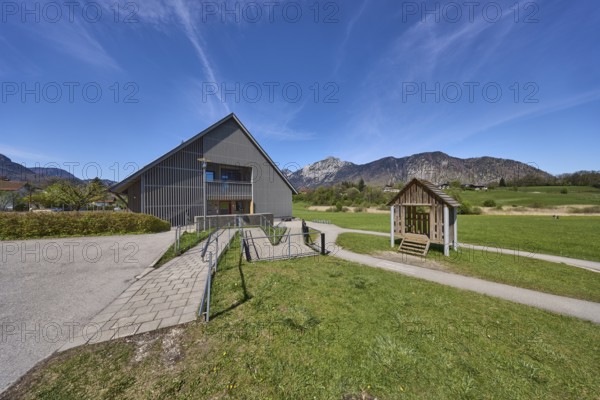 Catholic kindergarten St.Bruder Klaus, building, ramp, metal railing, meadows, mountain landscape, mountains, blue sky, cirrostratus clouds, Bayerisch Gmain, district Berchtesgadener Land, Bavaria, Germany