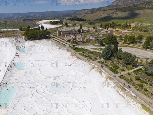 Wide view over limestone terraces and ancient ruins in a picturesque landscape, aerial view, sinter terraces, limestone sinter terraces, travertine terraces, Pamukkale, Denizli, UNESCO World Heritage Site, Anatolia, Turkey