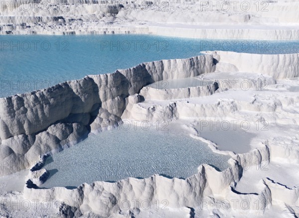 Natural limestone formations with turquoise-coloured water in several cascades. Structure appears geologically significant, aerial view, sinter terraces, limestone terraces, travertine terraces, Pamukkale, Denizli, UNESCO World Heritage Site, Anatolia, Turkey