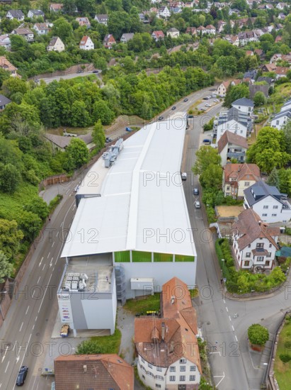 Modern buildings surrounded by trees and houses in a green, urban environment, City Centre Calw, Germany