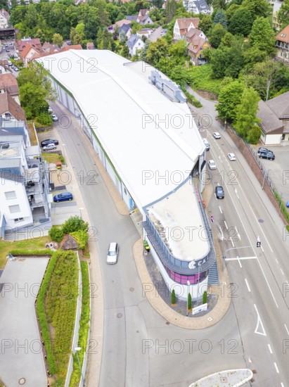 Aerial view of a modern building on a street corner in an urban environment, City Centre Calw, Germany