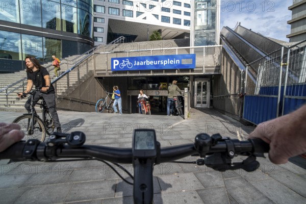 Ride your bike into and out of the bicycle car park at Utrecht Centraal station, Jaarbeursplein, over 13, 000 parking spaces, considered the largest bicycle car park in the world, over 3 underground floors, Utrecht, Netherlands