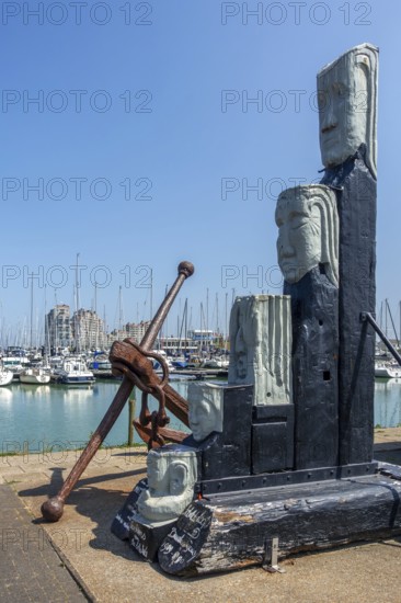 Wachters van de Schelde, sculpture by artist Omer Gielliet in the harbour of Breskens along the Western Scheldt, Zeeland, Netherlands