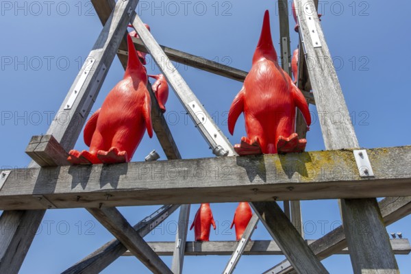 Rode Pinguins, Red Penguins, artwork by Belgian artist William Sweetlove in the harbour of Breskens along the Western Scheldt, Zeeland, Netherlands