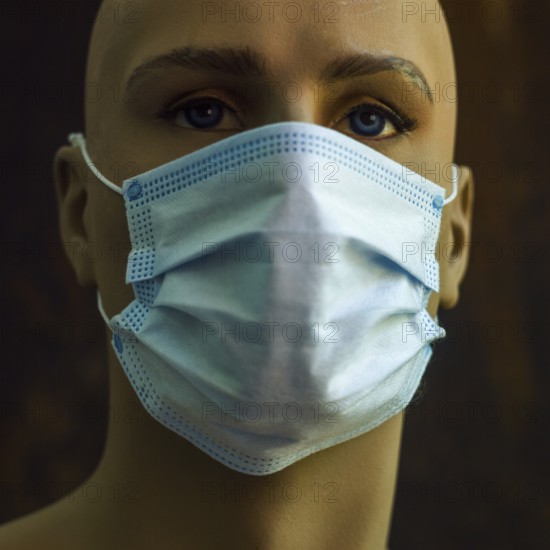 A mannequin displays a light blue surgical mask, emphasizing the significance of health safety during public gatherings. The setting suggests a focus on hygiene and protection