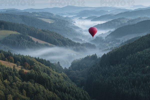 Hot air balloon red, hovering over misty fir forests in soft morning light, few autumnal colours between the treetops, view into the valley with river course, Black Forest, Germany, AI-generated, AI, AI generated