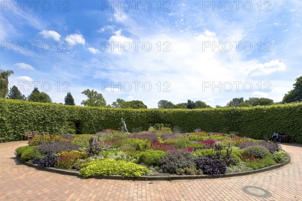 Lindenrund flower roundabout in Grugapark Essen, containing a bronze sculpture of a female javelin thrower from 1937 by sculptor and visual artist Ernst Seger, Essen, North Rhine-Westphalia, Germany