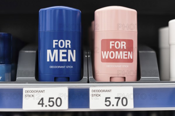 Gender-labeled deodorant sticks with unequal prices. Concept of pink tax in retail. Generative ai, AI generated