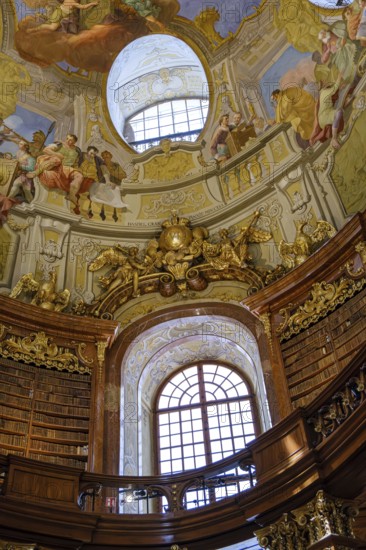 In the Baroque State Hall of the Court Library in the Austrian National Library in the Vienna Hofburg Imperial Palace, Vienna, Austria, for editorial use only