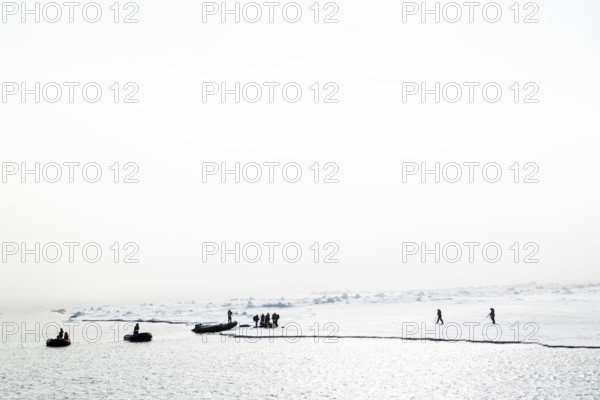 Zodiac with guides lands, Ice Edge, Sea, Spitsbergen, Svalbard
