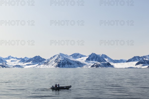 Zodiac in front of glacier, mountain range, snow, sea, Smeerenburg, Spitsbergen, Svalbard