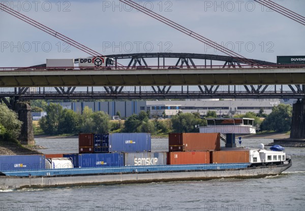 The Rhine near Duisburg, cargo ship, Beeckerwerther Rhine bridge, A42 motorway, Haus-Knipp railway bridge, North Rhine-Westphalia, Germany