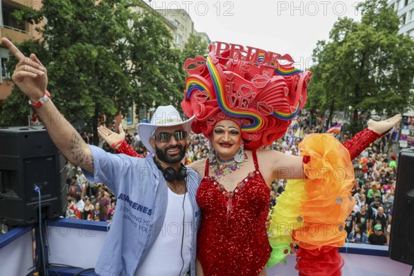 Michelle de la Rose (right) together with a DJ on one of the floats at CSD Berlin under the motto - Never be silent again - on 26 July 2025