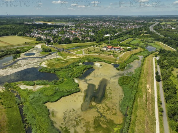 Dortmund, Castrop-Rauxel, North Rhine-Westphalia, Germany - River renaturalisation, renaturation of the Emscher, flood retention basin HRB Mengede. A new floodplain landscape is being created at the Emscher-Auen farm, expanding the area for flood protection during heavy rainfall and for biodiversity. The previously straightened Emscher is being given curves again and can meander through its new floodplain. Following the construction of a parallel sewer, the Emscher has been completely free of sewage since 2022. The river was previously an open, above-ground combined sewer with rainwater and wastewater