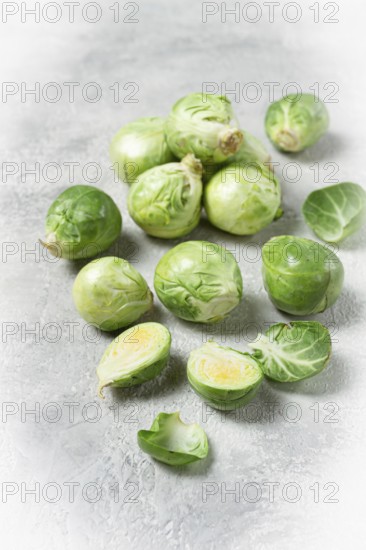 Fresh Brussels sprouts, raw, top view, on a gray table, no people