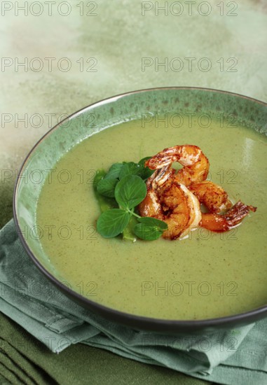Pea cream soup, with shrimp, green soup, homemade, top view, no people