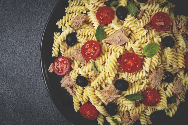 Tuna salad, fusilli pasta, olives and cherry, olive oil, homemade