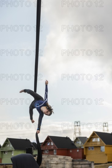 Aerial acrobatics, girls, catch for King Harald as part of the end of coal mining, Longyearbyen, Spitsbergen