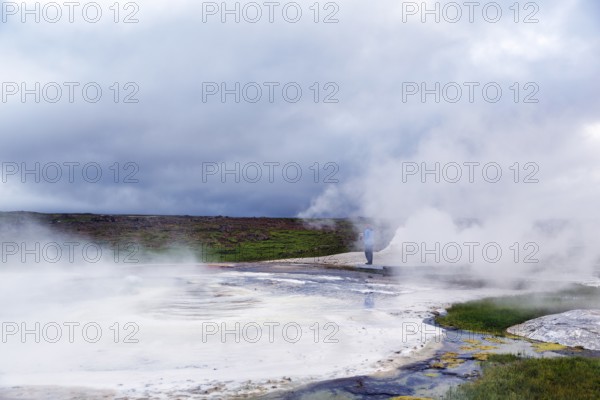 Walkers on a wooden path, sulphur vapour, Hveravellir geothermal area, Icelandic highlands, Suðurland, Sudurland, Iceland