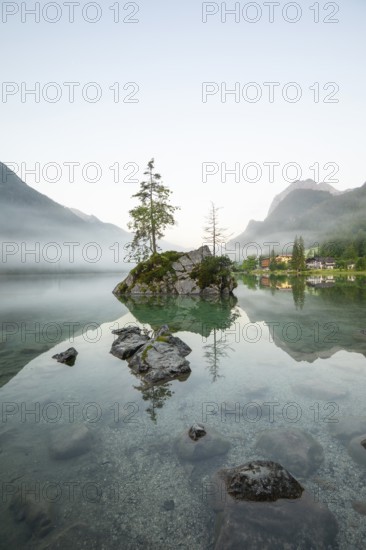 Magical summer sunrise with fog at Hintersee near Ramsau in Berchtesgadener Land