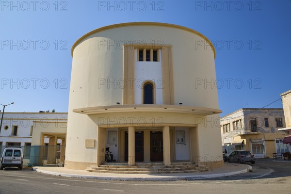 Cinema, Round, modern building with columns and light-coloured paint in an urban environment, Armando Bernabiti, Historicism, Rationalism, Art Deco, Rationalism, Rodolfo Petraco, Fascism, Portolago, Lakki, Leros, Dodecanese, Greek Islands, Greece