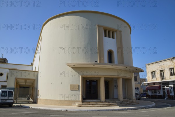 Cinema, A modern, round building with columns, cream-coloured façade under a clear blue sky, Armando Bernabiti, Historicism, Rationalism, Art Deco, Rationalism, Rodolfo Petraco, Fascism, Portolago, Lakki, Leros, Dodecanese, Greek Islands, Greece