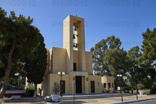 Church of Saint Francis, Church of Saint Nicholas, Agios Nikolaos, Church building with bell tower, surrounded by trees and lighting, Armando Bernabiti, Historicism, Rationalism, Art Deco, Rationalism, Rodolfo Petraco, Fascism, Portolago, Lakki, Leros, Dodecanese, Greek Islands, Greece