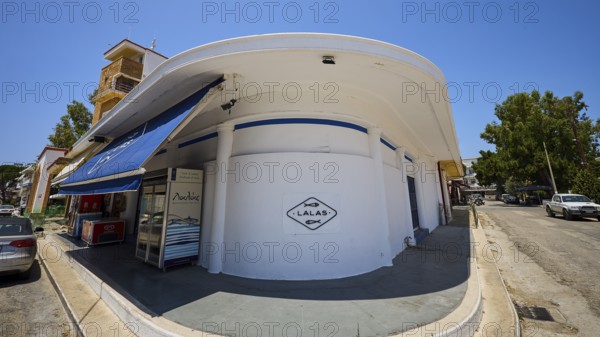 Fish market, Circular white building with blue awning, Street scene and shop signs, Armando Bernabiti, Historicism, Rationalism, Art Deco, Rationalism, Rodolfo Petraco, Fascism, Portolago, Lakki, Leros, Dodecanese, Greek Islands, Greece