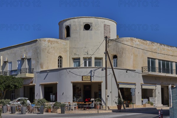 Municipal office, Farmazie, Corner building with round tower, café and open windows on a busy street corner, Armando Bernabiti, Historicism, Rationalism, Art Deco, Rationalism, Rodolfo Petraco, Fascism, Portolago, Lakki, Leros, Dodecanese, Greek Islands, Greece