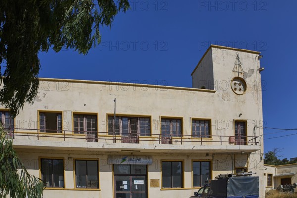 Harbour area, Vintage two-storey building with clock tower and old windows, Armando Bernabiti, Historicism, Rationalism, Art Deco, Rationalism, Rodolfo Petraco, Fascism, Portolago, Lakki, Leros, Dodecanese, Greek Islands, Greece
