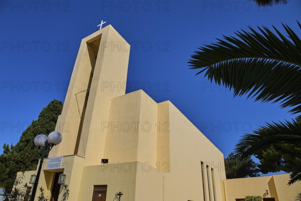 Church of Saint Francis, Church of Saint Nicholas, Agios Nikolaos, Modern church with cross and framed by palm trees against a clear sky, Armando Bernabiti, Historicism, Rationalism, Art Deco, Rationalism, Rodolfo Petraco, Fascism, Portolago, Lakki, Leros, Dodecanese, Greek Islands, Greece