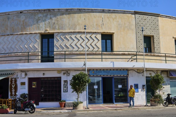 Historic commercial building with decorative elements and display windows, Armando Bernabiti, Historicism, Rationalism, Art Deco, Rationalism, Rodolfo Petraco, Fascism, Portolago, Lakki, Leros, Dodecanese, Greek Islands, Greece