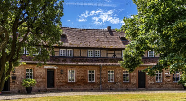 The old castle with Barbarossaplatz and the castle café in the old town centre of Büdingen, Hesse, Germany