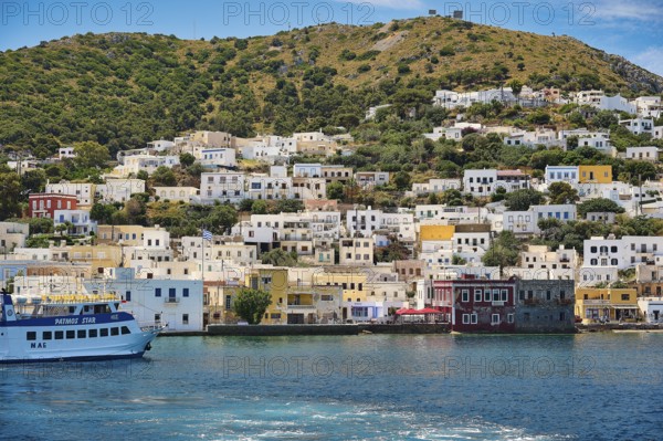 Colourful coastal town in Greece, white and yellow houses on the hillside, Lakki, Leros, Dodecanese, Greek Islands, Greece