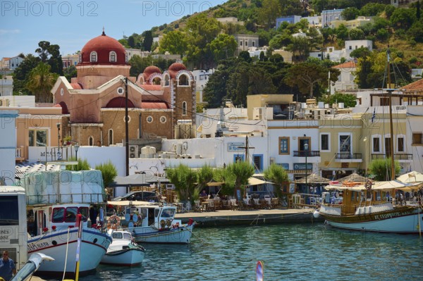 Picturesque coastal town with church, many boats and characteristic Mediterranean buildings, Lakki, Leros, Dodecanese, Greek Islands, Greece
