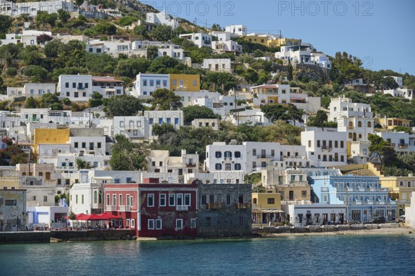 Colourful coastal houses on the hillside, Mediterranean architecture by the sea, Lakki, Leros, Dodecanese, Greek Islands, Greece