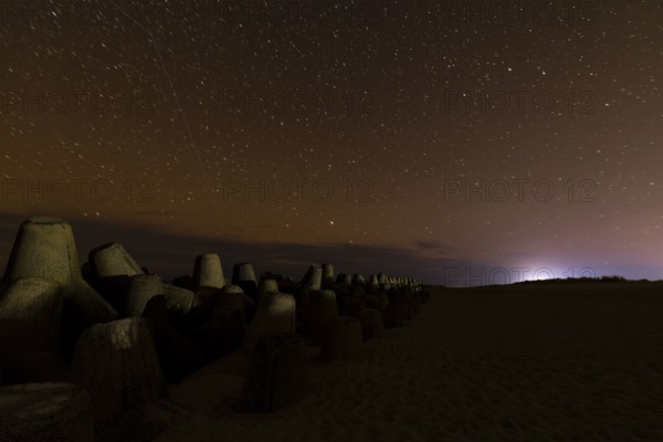 Northern Lights with Milky Way at the North Sea, Hörnum, Sylt, Tetrapode (stone), Schleswig-Holstein