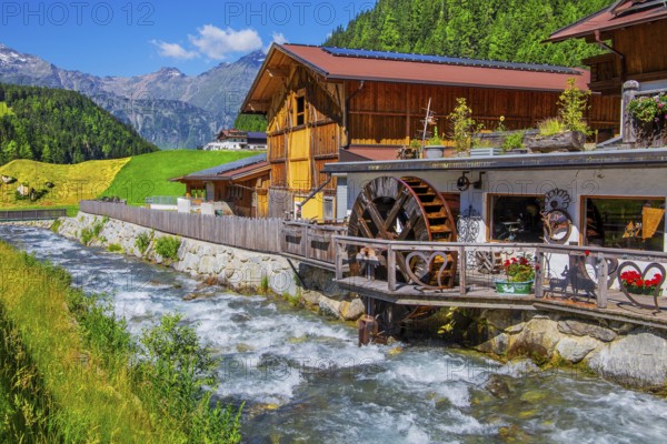 Old forge with water wheel on the Horlachbach, Niederthai in the Horlach Valley, side valley of the Ötztal, Stubai Alps, Tyrol, Austria