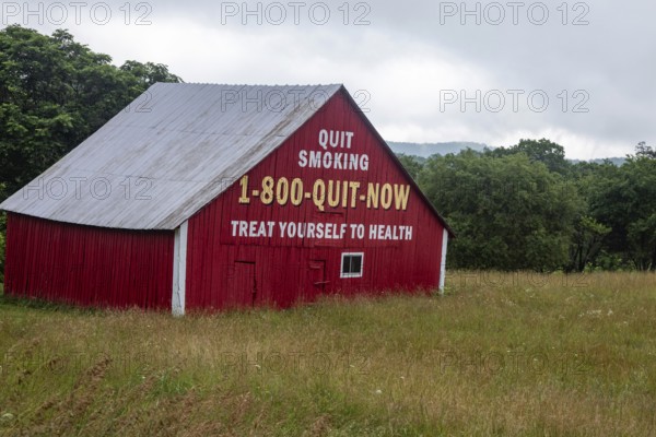 Marlinton, West Virginia - A barn in rural West Virginia is painted with an anti-smoking message. Treat Yourself to Health is a takeoff on Mail Pouch Tobacco's slogan that has decorated many barns in rural America: Treat Yourself to the Best
