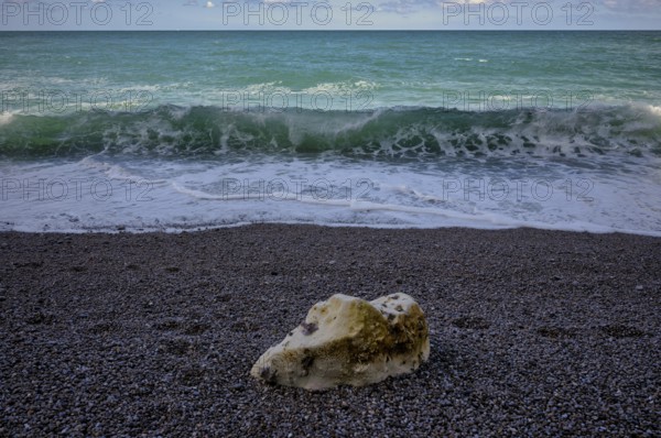Rock on beach, pebble beach, surf, sea, clouds, Étretat, Normandy, Seine-Maritime, France
