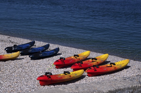 Kayaks, boats, colourful, lying on the beach, pebble beach, Étretat, sea, Normandy, Seine-Maritime, France