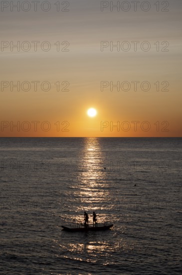 Children playing on bathing island, bathing raft, swimming island, Étretat, sea, sunset, evening mood, Normandy, Seine-Maritime, France